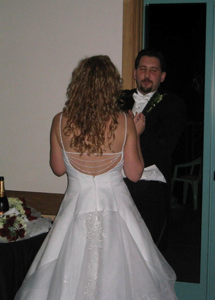 After cutting the cake, Emily went straight to the customary pepper spray the groom portion of the night's entertainment. 120_2061_IMG.jpg